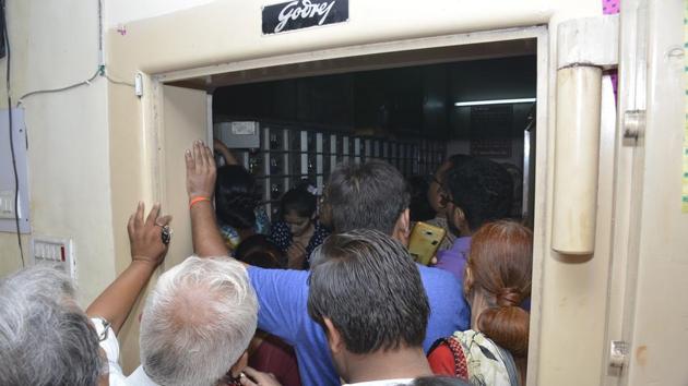 Customers read out the list and straightaway, barged into the strongroom after which they indulged in a verbal spat with bank officials. (Sakib Ali/HT Photo) Customers read out the list and straightaway, barged into the strongroom after which they indulged in a verbal spat with bank officials. (Sakib Ali/HT Photo)