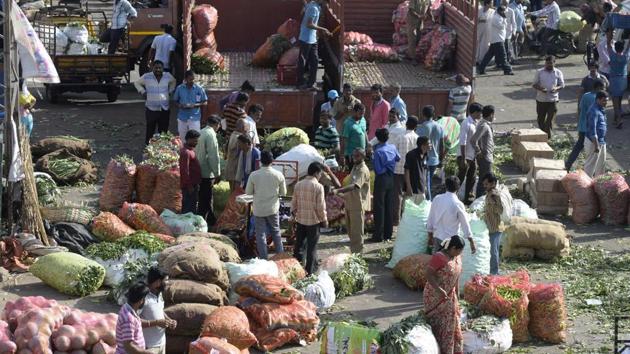 Traders and vendors negotiate prices of vegetables at a wholesale vegetable market in Hyderabad. (AFP) Traders and vendors negotiate prices of vegetables at a wholesale vegetable market in Hyderabad. (AFP)