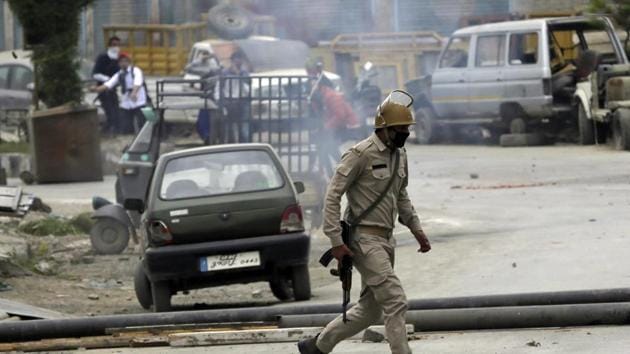 File photo of a policeman running for cover as Kashmiri students throw stones in Srinagar. On wedndesday J and K DGP SP Vaid claimed that the Jaish-e-Mohammad was behind the spate of attacks on security personnel in Kashmir Valley on Tuesday. (AP) File photo of a policeman running for cover as Kashmiri students throw stones in Srinagar. On wedndesday J and K DGP SP Vaid claimed that the Jaish-e-Mohammad was behind the spate of attacks on security personnel in Kashmir Valley on Tuesday. (AP)