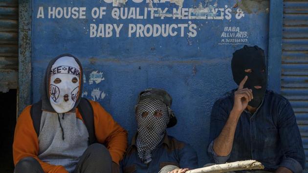 Masked Kashmiri protesters take a break from throwing stones at Indian police men during a protest in Srinagar, Indian controlled Kashmir, Friday, June 9, 2017. (AP) Masked Kashmiri protesters take a break from throwing stones at Indian police men during a protest in Srinagar, Indian controlled Kashmir, Friday, June 9, 2017. (AP)