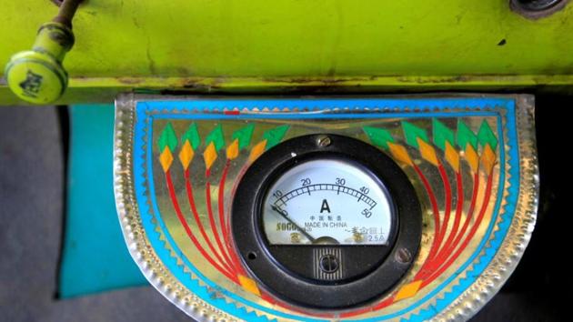 An electric gauge is seen in the cab of a decorated truck. (Caren Firouz/REUTERS)