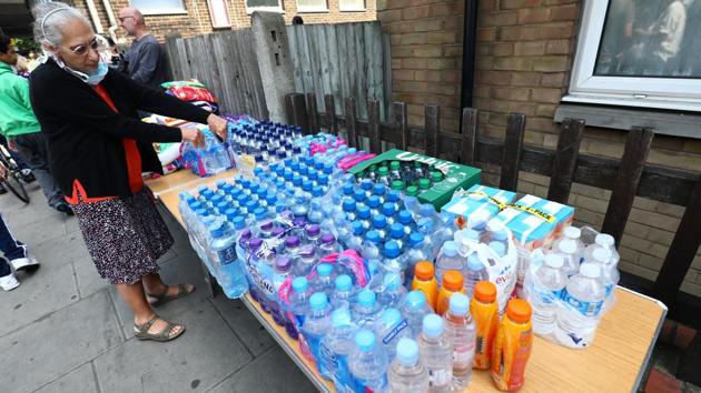 Mosques, gurdwaras and churches in West London have opened their doors to offer assistance to the survivors . (Neil Hall / REUTERS)