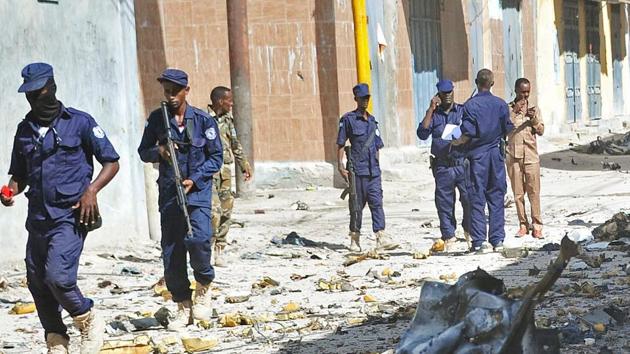 Somali security forces and civilians gather at the scene of a car bomb attack in Mogadishu on May, 15, 2017.(AFP File Photo)