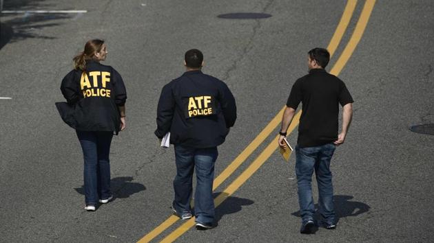 Bureau of Alcohol, Tobacco, Firearms and Explosive (ATF) police members walk near the crime scene. (Brendan Smialowski/AFP) Bureau of Alcohol, Tobacco, Firearms and Explosive (ATF) police members walk near the crime scene. (Brendan Smialowski/AFP)