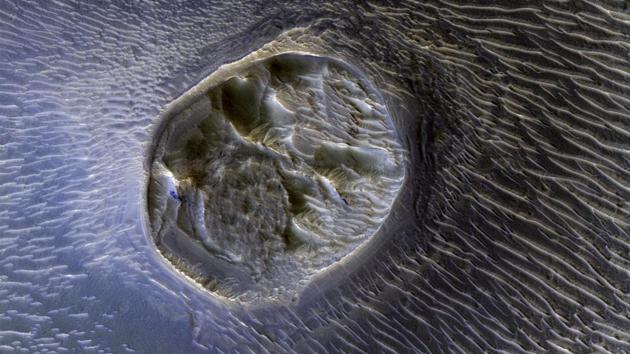In a scientific paper published recently, Elon Musk has outlined detailed plans to try and establish a Martian Colony. Since arriving into the Mars orbit more than a decade ago, the Mars Orbital Reconnaissance mission has sent back more than 250,000 images revealing Mars in ways never seen before. Shown above are surreal sand dunes in Noctis Labyrinthyus, an extensively fractured region on the western end of Valles Marineris on the red planet. (NASA)