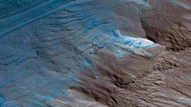 Erosion of the Edge of the South Polar Layered Deposits:The sloping edge of the stack of icy layers over the South Pole, has some interesting morphologies.