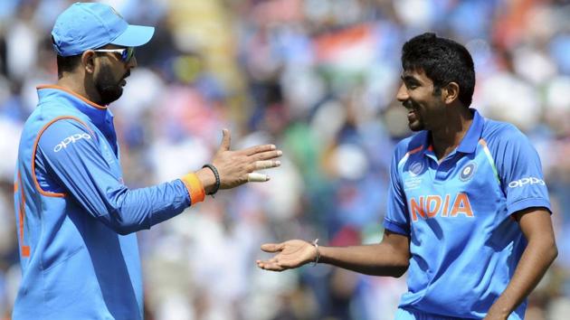 India's Yuvraj Singh, left, and  Jasprit Bumrah react during the ICC Champions Trophy semifinal match. (AP) 