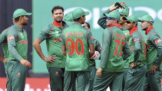 Bangladesh players celebrate after India's Shikhar Dhawan was bowled out by Bangladesh's Mashrafe Mortaza. (AP) 