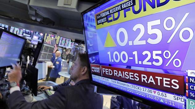 The rate decision of the Federal Reserve is shown on a television on the floor of the New York Stock Exchange. (AP Photo) The rate decision of the Federal Reserve is shown on a television on the floor of the New York Stock Exchange. (AP Photo)