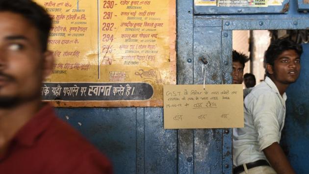 A local market's gate shut down with a notice announcing GST as the cause of closure in Old Delhi. (Saumya Khandelwal/HT PHOTO) A local market's gate shut down with a notice announcing GST as the cause of closure in Old Delhi. (Saumya Khandelwal/HT PHOTO)