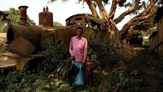Train driver Rafid Kabadi, 49, poses for a photograph with his grandson in front of an abandoned train that he used to drive in Janakpur, Nepal. Shrubs have sprung around the rusted train engine in mute testimony to years of neglect suffered by an abandoned railway line.First built as a cargo line to carry wood from Nepal to India in 1937, it was once the lifeblood of the community in Janakpur. (Navesh Chitrakar / REUTERS)