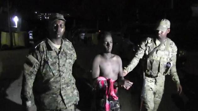 An injured man is evacuated from the scene of a blast in a restaurant in Mogadishu, Somalia.(AP Photo) An injured man is evacuated from the scene of a blast in a restaurant in Mogadishu, Somalia.(AP Photo)