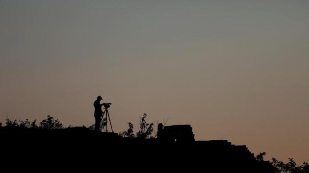 A cameraman documents the reconstruction project of the Great Wall of China in Beijing. (Damir Sagolj/REUTERS) A cameraman documents the reconstruction project of the Great Wall of China in Beijing. (Damir Sagolj/REUTERS)