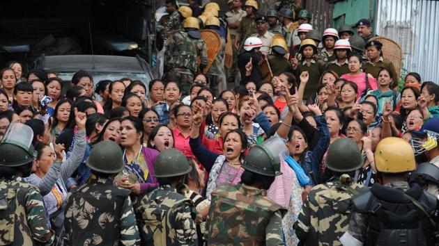 Police personnel stop Gorkha Janmukti Morcha (GJM) supporters following a raid at the GJM office in Darjeeling on June 15, 2017. Incidents of arson against government establishments were reported throughout Thursday. (Diptendu Dutta/AFP) Police personnel stop Gorkha Janmukti Morcha (GJM) supporters following a raid at the GJM office in Darjeeling on June 15, 2017. Incidents of arson against government establishments were reported throughout Thursday. (Diptendu Dutta/AFP)