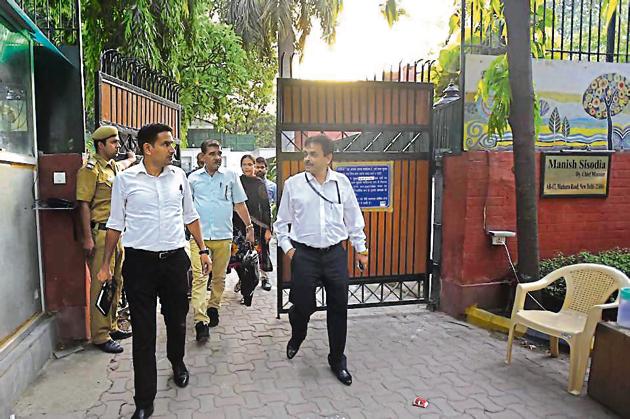 CBI officials leave Manish Sisodia's residence in New Delhi on Friday. (Sonu Mehta/HT PHOTO) CBI officials leave Manish Sisodia's residence in New Delhi on Friday. (Sonu Mehta/HT PHOTO)