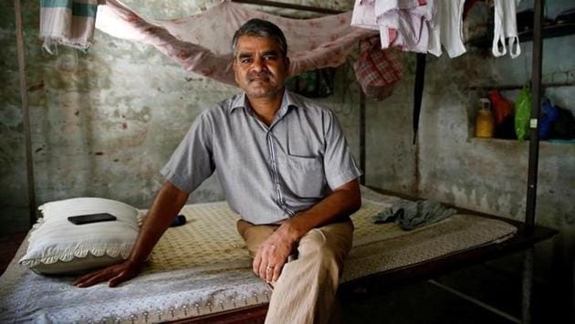 Tula Bahadur Dangi, 49, acting general manager of Nepal Railways Corporation sits inside his quarters in Nepal. (Navesh Chitrakar / REUTERS)