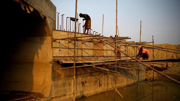 Indian labourers work on part of a bridge for the new railway in Janakpur. The revamp of the railway, set to be completed next March, presents clear signs of renewal and the improvements to come. (Navesh Chitrakar / REUTERS)