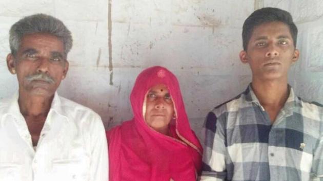 Dalit student Dilip Kumar with his parents.(HT Photo)