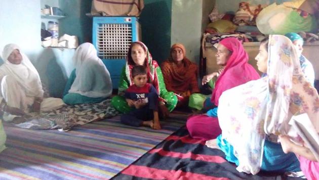 Family members of Zaffar Hussein, who was allegedly beaten to death by Rajasthan government officials on Friday, at their home in Pratapgarh.(Salik Ahmad/HT photo)