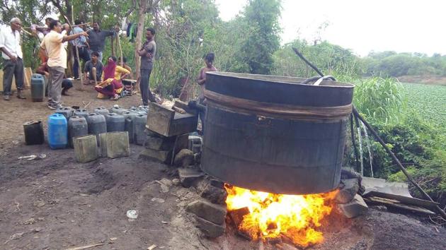 Over 700 litres of illegal alcohol was found stored in 10 barrels in the raid. (HT PHOTO) Over 700 litres of illegal alcohol was found stored in 10 barrels in the raid. (HT PHOTO)