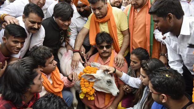BJP Yuva Morcha activists protest in New Delhi against slaughter of Cow .(HT FILE PHOTO)