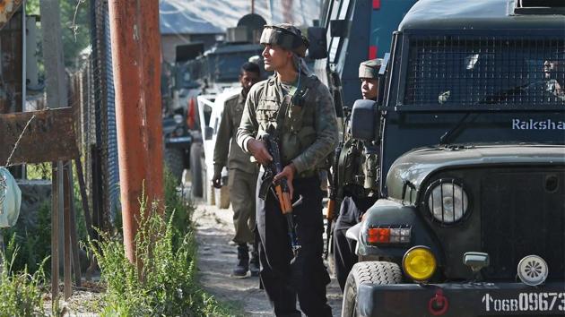 Army jawans stand guard during an encounter with militants at Arwani village of Anantnag district of south Kashmir on Friday. (PTI) Army jawans stand guard during an encounter with militants at Arwani village of Anantnag district of south Kashmir on Friday. (PTI)