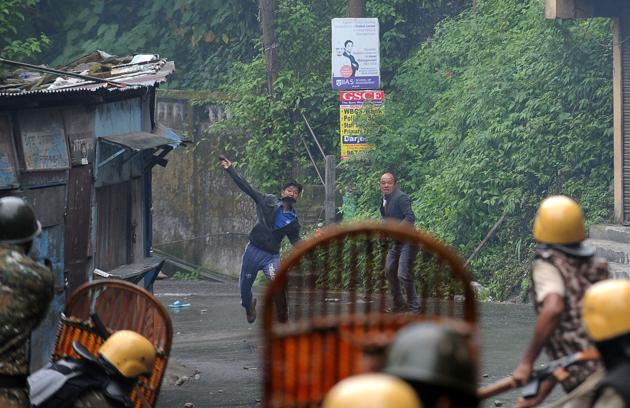 Supporter of the Gorkha Janmukti Morcha (GJM) clash with security forces in Darjeeling on Saturday. (AFP File Photo) Supporter of the Gorkha Janmukti Morcha (GJM) clash with security forces in Darjeeling on Saturday. (AFP File Photo)