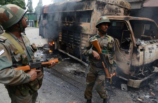Army was deployed in the restive hills after GJM supporters clashed with security forces and set ablaze police vehicles and several government offices. (AFP Photo) Army was deployed in the restive hills after GJM supporters clashed with security forces and set ablaze police vehicles and several government offices. (AFP Photo)