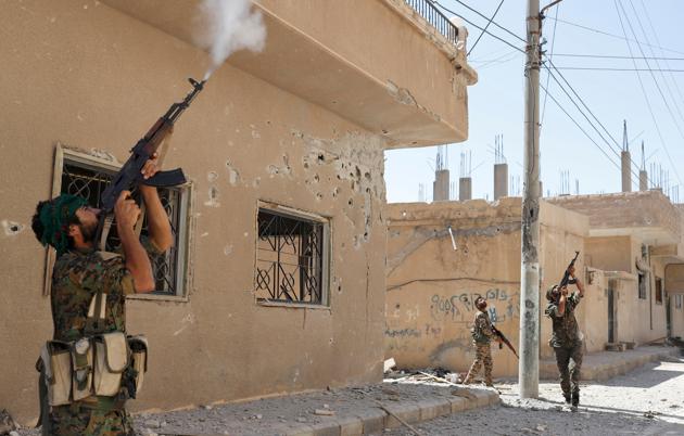 Kurdish fighters from the People's Protection Units (YPG) in Raqqa, Syria. (Reuters) Kurdish fighters from the People's Protection Units (YPG) in Raqqa, Syria. (Reuters)