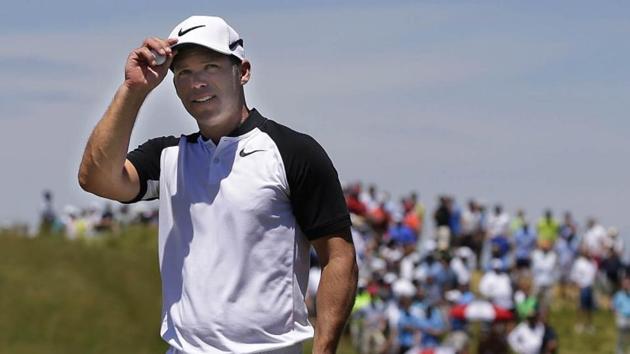 Paul Casey, joint leader of the US Open golf tournament (alongside Brooks Koepka, Brian Harman and Tommy Fleetwood) greets the crowd after finishing on the 9th green during the second round at Erin Hills on Friday.(Rueters)