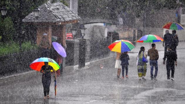 Umbrellas brighten up the damp day as it rains in Shimla on Saturday, June 17. (Deepak Sansta/HT)