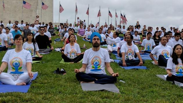 Indian Ambassador to US Navy Sarna joining yoga enthusiasts to celebrate international yoga day at the National Mall in Washington DC on Saturday. (PTI Photo) Indian Ambassador to US Navy Sarna joining yoga enthusiasts to celebrate international yoga day at the National Mall in Washington DC on Saturday. (PTI Photo)