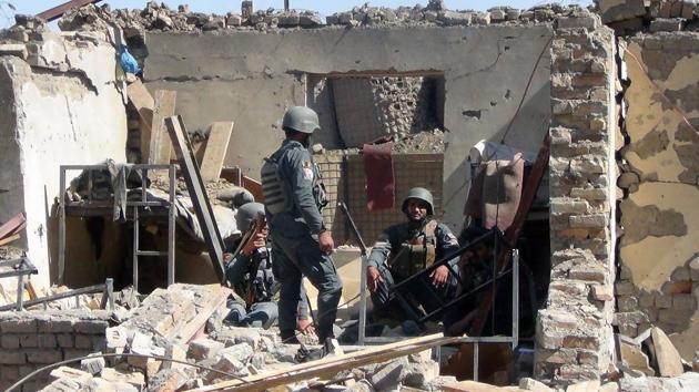 Afghan policemen gather at the site of a suicide bombing attack on the police headquarters in Gardez, capital of Paktia province. (AFP Photo) Afghan policemen gather at the site of a suicide bombing attack on the police headquarters in Gardez, capital of Paktia province. (AFP Photo)