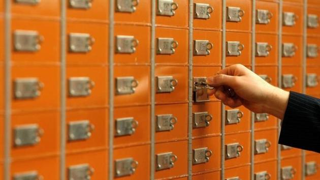 An employee checks a safe box in the vault of a Swiss bank in Basel, Switzerland. (Reuters File Photo) An employee checks a safe box in the vault of a Swiss bank in Basel, Switzerland. (Reuters File Photo)