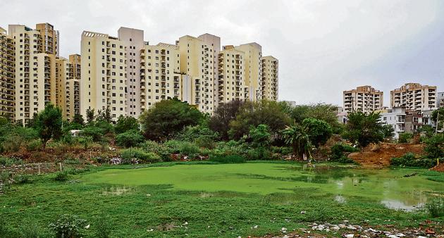 After extensive waterlogging last year, Gurgaon’s civic authorities had planned to review the city’s water bodies in a bid to enable them to hold rainwater. (Parveen Kumar/HT PHOTO) After extensive waterlogging last year, Gurgaon’s civic authorities had planned to review the city’s water bodies in a bid to enable them to hold rainwater. (Parveen Kumar/HT PHOTO)