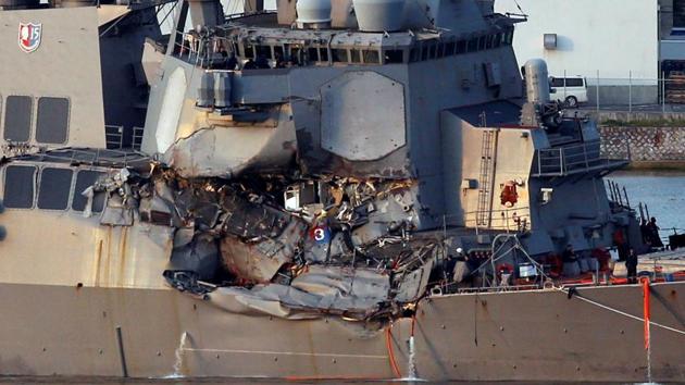 The Arleigh Burke-class guided-missile destroyer USS Fitzgerald, damaged by colliding with a Philippine-flagged merchant vessel, is towed into the US naval base in Yokosuka, south of Tokyo, Japan. (Reuters Photo) The Arleigh Burke-class guided-missile destroyer USS Fitzgerald, damaged by colliding with a Philippine-flagged merchant vessel, is towed into the US naval base in Yokosuka, south of Tokyo, Japan. (Reuters Photo)