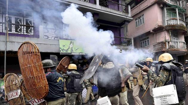 Security personnel fire teargas shells during a protest by GJM activists in Darjeeling on Saturday. (PTI Photo) Security personnel fire teargas shells during a protest by GJM activists in Darjeeling on Saturday. (PTI Photo)