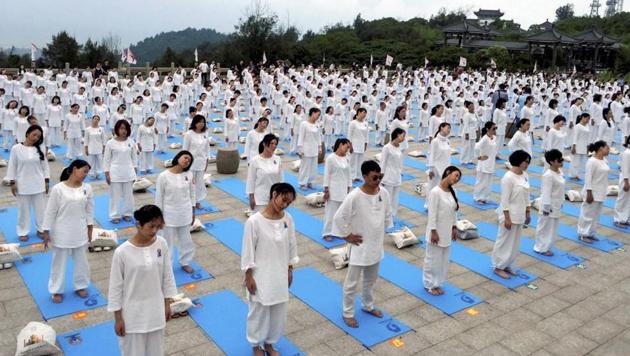 Yoga enthusiasts participate in an event to celebrate 3rd International Day of Yoga in Wenzhou, China on June 18, 2017. (PTI) Yoga enthusiasts participate in an event to celebrate 3rd International Day of Yoga in Wenzhou, China on June 18, 2017. (PTI)