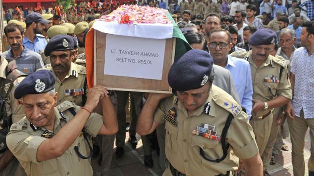 Senior police officers carry a coffin containing the body of a slain policeman Tasveer Ahamad during the wreath-laying ceremony at the police headquarters of Srinagar, June 17, 2017. Six policemen were killed attacks by militants in south Kashmir on June 16. (Waseem Andrabi / Hindustan Times) Senior police officers carry a coffin containing the body of a slain policeman Tasveer Ahamad during the wreath-laying ceremony at the police headquarters of Srinagar, June 17, 2017. Six policemen were killed attacks by militants in south Kashmir on June 16. (Waseem Andrabi / Hindustan Times)