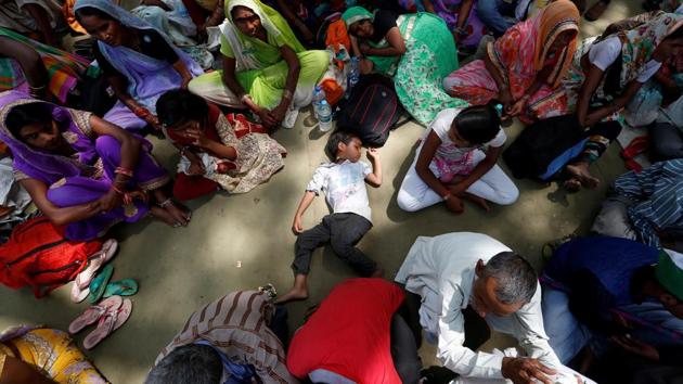 A boy sleeps as farmers attend a protest against the killing of six farmers during clashes in the central state of Madhya Pradesh, in New Delhi, India. (REUTERS) A boy sleeps as farmers attend a protest against the killing of six farmers during clashes in the central state of Madhya Pradesh, in New Delhi, India. (REUTERS)