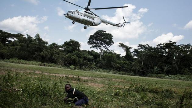 A young boy lies on a field as an helicopter carrying medical supplies and health workers specialised in Ebola virus, takes off in Muma. Two cases of the Ebola virus have been confirmed in a laboratory while 18 others are suspected in the remote Bas-Uele province, an equatorial forest zone near the Central African Republic. It is the first outbreak of Ebola, which spreads by contact with bodily fluids, since the west Africa epidemic that ended in January last year after killing more than 11,300 people and sickening nearly 29,000. (John Wessels/AFP) A young boy lies on a field as an helicopter carrying medical supplies and health workers specialised in Ebola virus, takes off in Muma. Two cases of the Ebola virus have been confirmed in a laboratory while 18 others are suspected in the remote Bas-Uele province, an equatorial forest zone near the Central African Republic. It is the first outbreak of Ebola, which spreads by contact with bodily fluids, since the west Africa epidemic that ended in January last year after killing more than 11,300 people and sickening nearly 29,000. (John Wessels/AFP)
