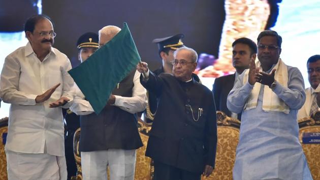 President Pranab Mukherjee flags off the entire phase 1 of Namma Metro as Karnataka Chief minister Siddaramaiah and Union Minister for Urban Development Venkaiah Naidu look on at Vidhan Soudha on June 17, 2017. The 42.3-km-long project, which started in 2008, has been built at a cost of about Rs 13,845 crore, of which Rs 300 crore was raised by floating bonds, a first in the Metro history of the country. (Arijit Sen/HT Photo) President Pranab Mukherjee flags off the entire phase 1 of Namma Metro as Karnataka Chief minister Siddaramaiah and Union Minister for Urban Development Venkaiah Naidu look on at Vidhan Soudha on June 17, 2017. The 42.3-km-long project, which started in 2008, has been built at a cost of about Rs 13,845 crore, of which Rs 300 crore was raised by floating bonds, a first in the Metro history of the country. (Arijit Sen/HT Photo)