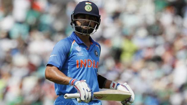 India's Virat Kohli leaves the pitch after being dismissed for five runs during the ICC Champions Trophy final against Pakistan.(AP)