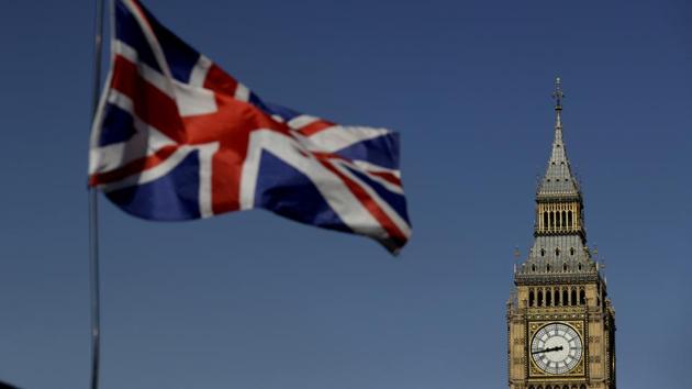 A British Union flag flies above a stand selling tourist souvenirs backdropped by the Houses of Parliament in London, Monday, June 19, 2017. (AP Photo) A British Union flag flies above a stand selling tourist souvenirs backdropped by the Houses of Parliament in London, Monday, June 19, 2017. (AP Photo)
