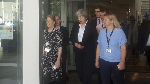 Britain's Prime Minister Theresa May, centre, leaves the Chelsea and Westminster Hospital in London after visiting people who were injured in the Grenfell Tower fire. (AP Photo) Britain's Prime Minister Theresa May, centre, leaves the Chelsea and Westminster Hospital in London after visiting people who were injured in the Grenfell Tower fire. (AP Photo)