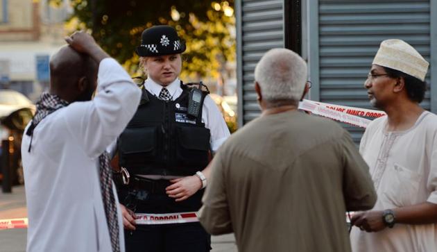 A police officer talks to local people at Finsbury Park in north London, where a vehicle struck pedestrians on Monday. (AP) A police officer talks to local people at Finsbury Park in north London, where a vehicle struck pedestrians on Monday. (AP)