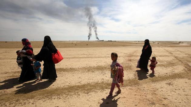 Displaced Iraqi families evacuate from the modern town of Hatra and neighbouring villages, near the eponymous UNESCO-listed ancient city, southwest of the northern city of Mosul, on April 26, 2017, as pro-government Hashed al-Shaabi (Popular Mobilisation) paramilitary forces advance during an offensive to retake the area from Islamic State (IS) group fighters. Hatra is the latest important archaeological site to be recaptured from IS. Jihadists had embarked on a campaign of destruction against archaeological sites after they seized swathes of Iraq and Syria in a lightning 2014 offensive. The full extent of the harm to Hatra remains unclear. (AFP) Displaced Iraqi families evacuate from the modern town of Hatra and neighbouring villages, near the eponymous UNESCO-listed ancient city, southwest of the northern city of Mosul, on April 26, 2017, as pro-government Hashed al-Shaabi (Popular Mobilisation) paramilitary forces advance during an offensive to retake the area from Islamic State (IS) group fighters. Hatra is the latest important archaeological site to be recaptured from IS. Jihadists had embarked on a campaign of destruction against archaeological sites after they seized swathes of Iraq and Syria in a lightning 2014 offensive. The full extent of the harm to Hatra remains unclear. (AFP)
