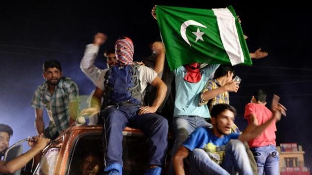 Kashmiri cricket fans celebrate in Srinagar after Pakistan's win in the International Cricket Championship (ICC) Champions Trophy final cricket match against India.(AFP)