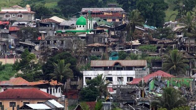 Damaged buildings and houses are seen as government forces continue their assault against insurgents. The collapse in security in the southern Philippines has alarmed neighbours such as Indonesia and Malaysia.  (REUTERS) 