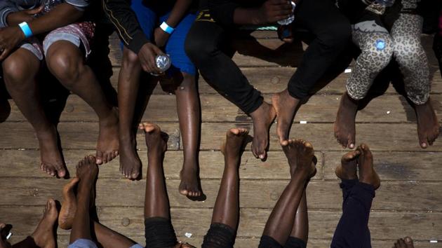 Women on their way to Italy sit on the deck of the rescue vessel Golfo Azzurro, after being rescued by Spanish NGO Proactiva Open Arms workers from the Mediterranean Sea on Friday, June. 16, 2017. (AP) Women on their way to Italy sit on the deck of the rescue vessel Golfo Azzurro, after being rescued by Spanish NGO Proactiva Open Arms workers from the Mediterranean Sea on Friday, June. 16, 2017. (AP)